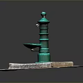 Green Water Fountain On Square Concrete Base With Red Brick Paved Ground And Drainage Grate