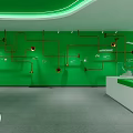 Cultural Art Exhibition Hall With Green Wall Orange Pipe Decor Circular Installations And White Counter