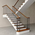 Modern Staircase Featuring Wooden Handrail Metal Balusters And Wooden Steps With Light Wall