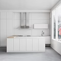 Modern White Kitchen Interior With Stainless Steel Range Hood And Island Counter