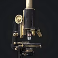 Three Vintage Medical Microscopes with Classic Brass and Black Medical Equipment Design