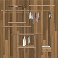 Metal Clothes Rack With Hanging Colored Clothes And Wooden Wall Interior