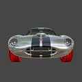 Silver Vintage Sports Car With Black Stripes Sleek Body Round Headlights And Black Roof