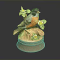 Ceramic Bird Figurine Featuring Black Head Orange Chest Green Leaves White Flowers And Brown Base
