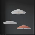 Modern Round Pendant Lights White And Pink With Golden Details Against Dark Wall Background