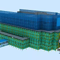 Construction Site With Green Scaffolding Blue Safety Netting Tower Crane And Temporary Office