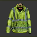 High Visibility Yellow Safety Jacket With Reflective Strips And Front Pockets On Wooden Hanger
