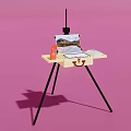 Yellow Tripod Table with Musical Instruments Art Supplies Easel Paint Tubes Brushes and Palette