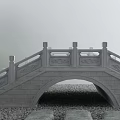 Stone Arch Bridge With Intricate Carved Railings And Pebble Ground Near Small Tree