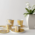 Elegant Ceramic Tea Set with Patterned Cups Saucers and White Orchid Vase 3d model