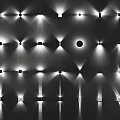 Illuminated Wall Lamps With Various Styles And Projected Light Effects On Black Background
