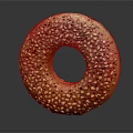 Golden Shiny Seed Covered Bagel with Sesame and Poppy Seeds on Dark Background