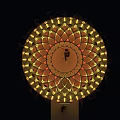 Golden Egg Shaped Art Installation Featuring Diamond Lattice Design And Illuminated Ring On Water Surface