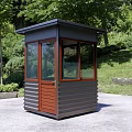 Outdoor Guard Booth With Glass Windows Wooden Door And Dark Roof In Landscaped Area