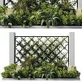 Decorative Lattice Fence Surrounded By Lush Green Plants Between Pillars