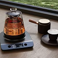 Electric Glass Kettle On Wooden Tabletop With Wooden Handle Container And Small Cup On Tray