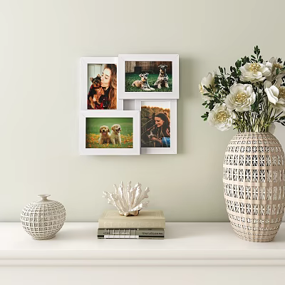 Multiple White Photo Frames with Family Pet Photos Decorative Vase White Flowers and Stacked Books 3d model