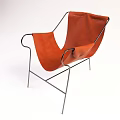 Modern Single Chair With Orange Upholstered Seat And Metal Frame Design