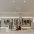 Stylish Clothing Store Interior Design With Displayed Clothes Clothing Racks And Plants