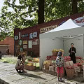 Scenic Garden Landscape With Open Air Fruit Stall Stone Pavement And Trees