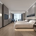 Modern Hotel Guest Room With King Bed Wooden Flooring TV And Sofa Chair
