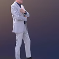 A Man In Light Gray Suit With Arms Crossed Pointing With Index Finger