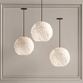 Three White Spherical Pendant Lights With Moon Surface Texture Black Cords And Light Wall Background 3d model