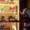 Modern Display Cabinet With Glass Doors And Illuminated Shelves For Collectible Toy Models