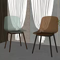 Modern Transparent and Golden Dining Chairs with Dark Legs Near White Curtains and Green Plant