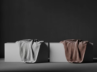 Two White Cubes With Light Gray And Brown Blankets On Dark Background 3d model