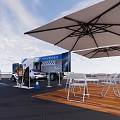 Exhibition Booth With Car Display Screen Outdoor Seating And Umbrella Shade Setup