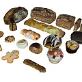 Assorted Freshly Baked Food Including Baguette Croissant Gingerbread Man Cake And Fruit Desserts