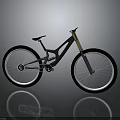 Black Mountain Bike with Large Wheels Yellow Fork and Black Frame on Gray Reflective Surface