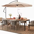 Outdoor Wooden Dining Table With Wicker Chairs Fruit Flowers And Umbrella On Deck