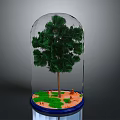 Green Tree Inside Transparent Glass Dome With Green Grass Orange Sand On Blue Base