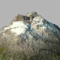 Natural Mountain Terrain With Snow Capped Peak And Green Vegetation Slopes