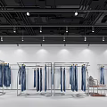 Clothing Store With Metal Racks Blue Jeans White Walls Black Ceiling Lighting And Small Table