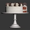 Red Velvet Cake with Cookies and Cream Topping Sliced Side on White Cake Stand