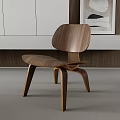 Modern Walnut Leisure Chair With Curved Backrest And Wooden Frame In Minimalist Interior
