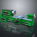 Green Lathe Machine With Control Panel Spindle And Reflective Surface