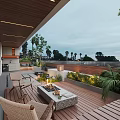 Cozy Villa Balcony With Wooden Deck Fire Pit Wicker Chairs Green Plants And Scenic View