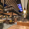 Modern Restaurant Interior Design With Hanging Lamps Staircase And Decorative Elements