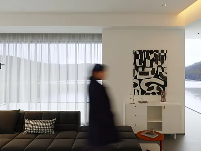 Woman in modern living room with gray sofa mountain view window and black abstract painting 3d model