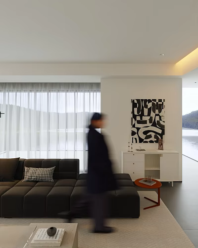 Woman in modern living room with gray sofa mountain view window and black abstract painting 3d model