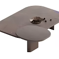 Modern Coffee Table Featuring Irregular Dark Top Decorative Bowl And Black Beads