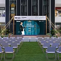Floral Display in Shopping Mall Indoor Space With ISO Signage Greenery Tents and Fencing