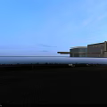 Modern Entrance Gate Between High Rise Buildings With Glass Curtain Walls And Paved Ground
