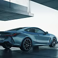 Blue Sports Coupe With Sleek Aerodynamic Body And Stylish Alloy Wheels Under Modern Architecture