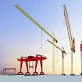 Industrial Construction Equipment Featuring Red Gantry And Yellow Tower Cranes At Outdoor Site