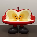 Apple Shaped Public Chair With Red Exterior Yellow Interior And Black Legs